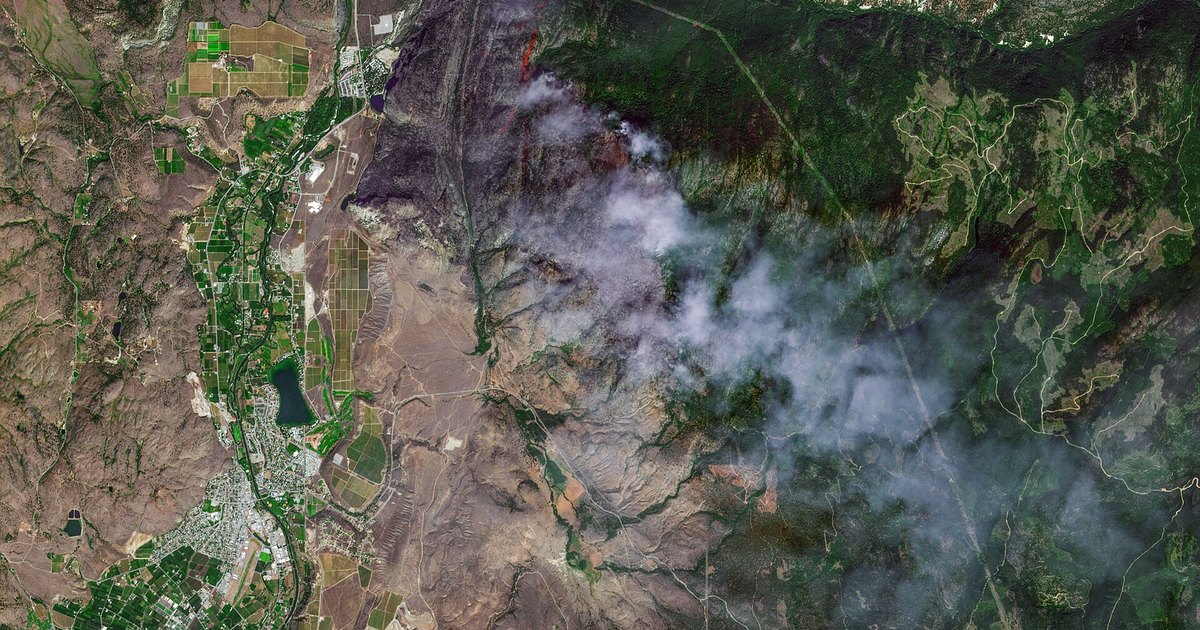 Smoke rising from a wildfire in the hills of British Columbia.