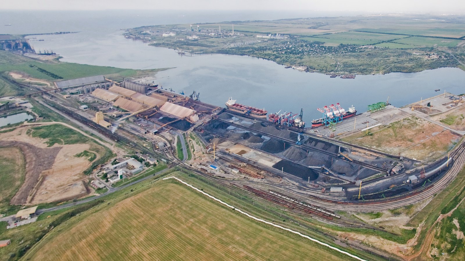 An aerial view of a bulk cargo and grain terminal on the Black Sea coast.