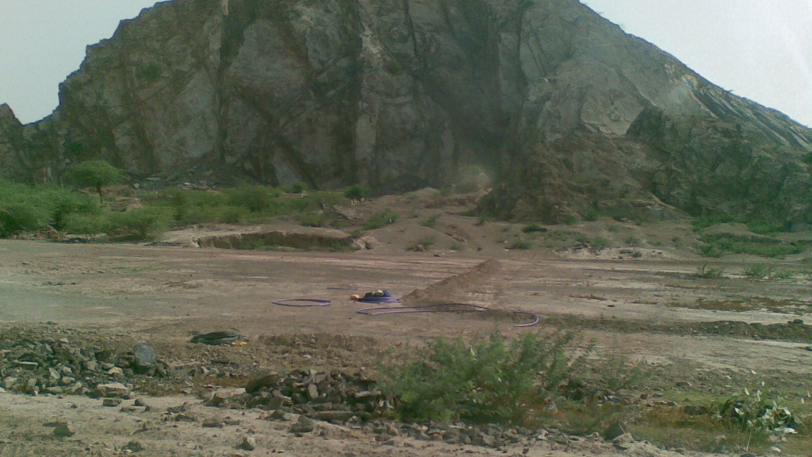 A distant view of the rocky Kirana range landscape in Punjab, Pakistan.