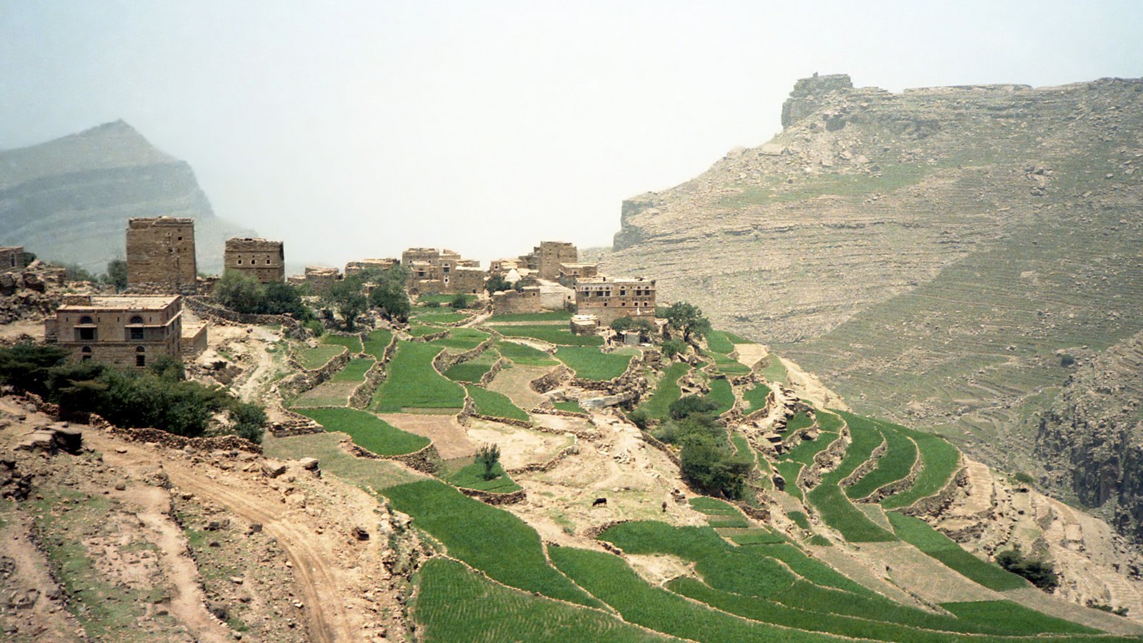 A mountainous landscape in Yemen beside a transport route.