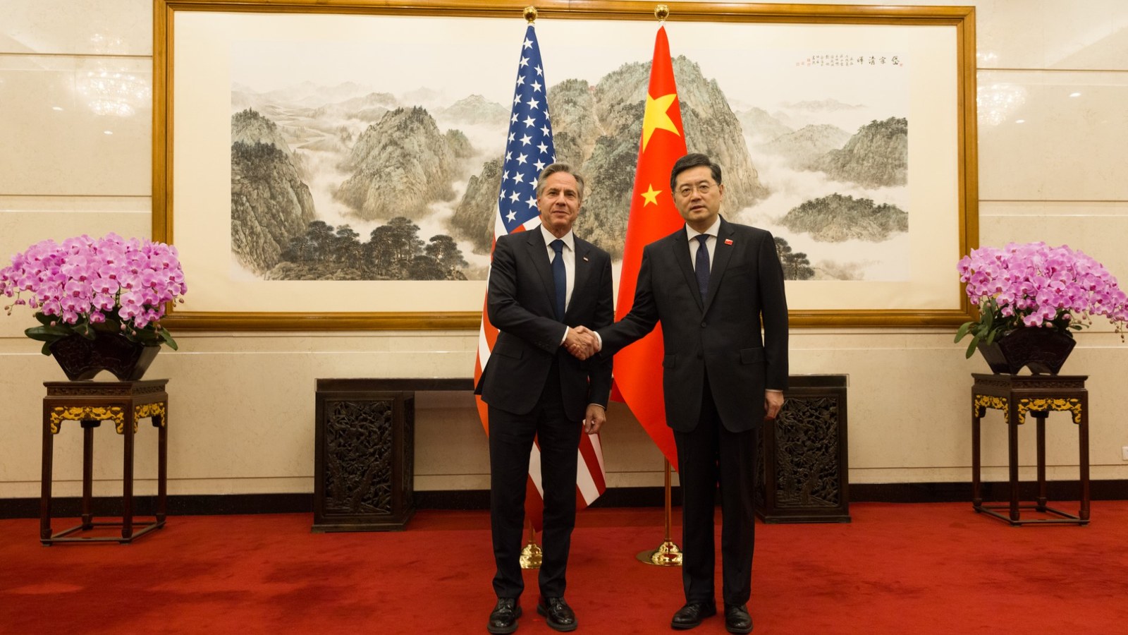 United States and Chinese flags displayed together at a diplomatic venue