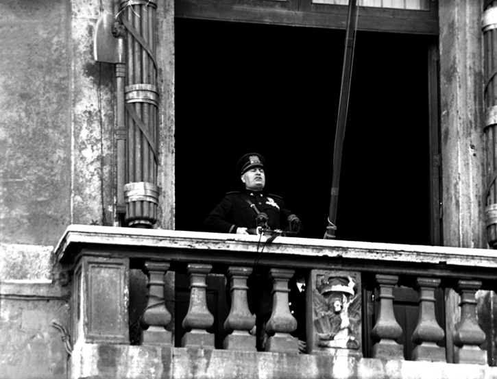 Benito Mussolini addresses a crowd from the balcony of the Palazzo Venezia