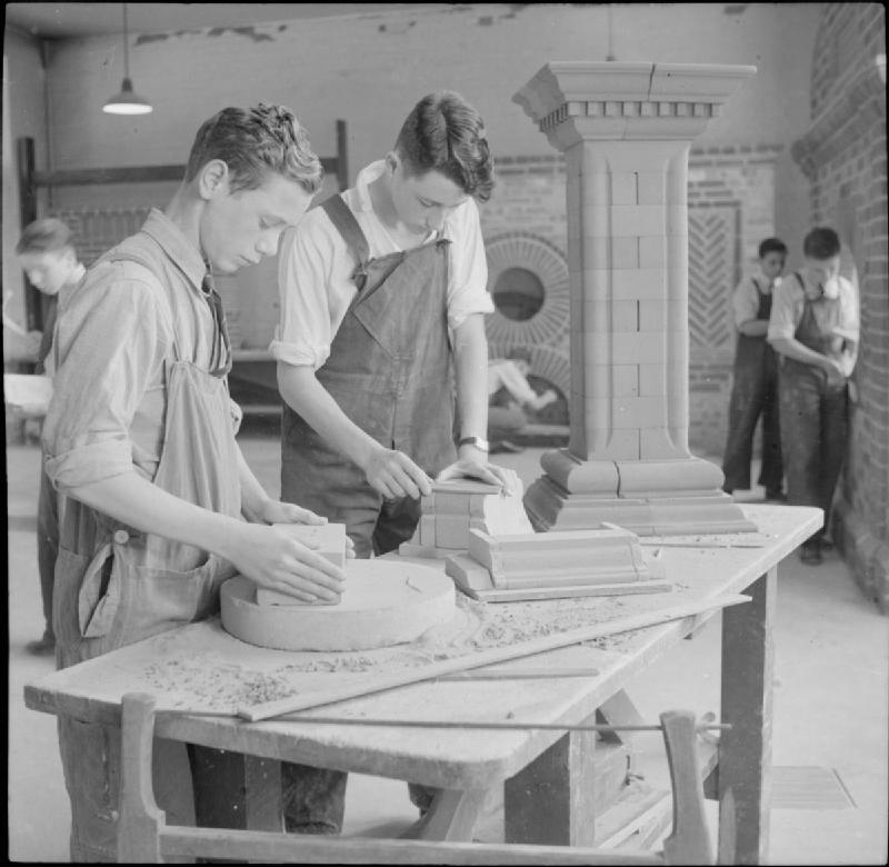 Boys learning brickwork in a technical workshop at Tottenham Polytechnic in 1944.