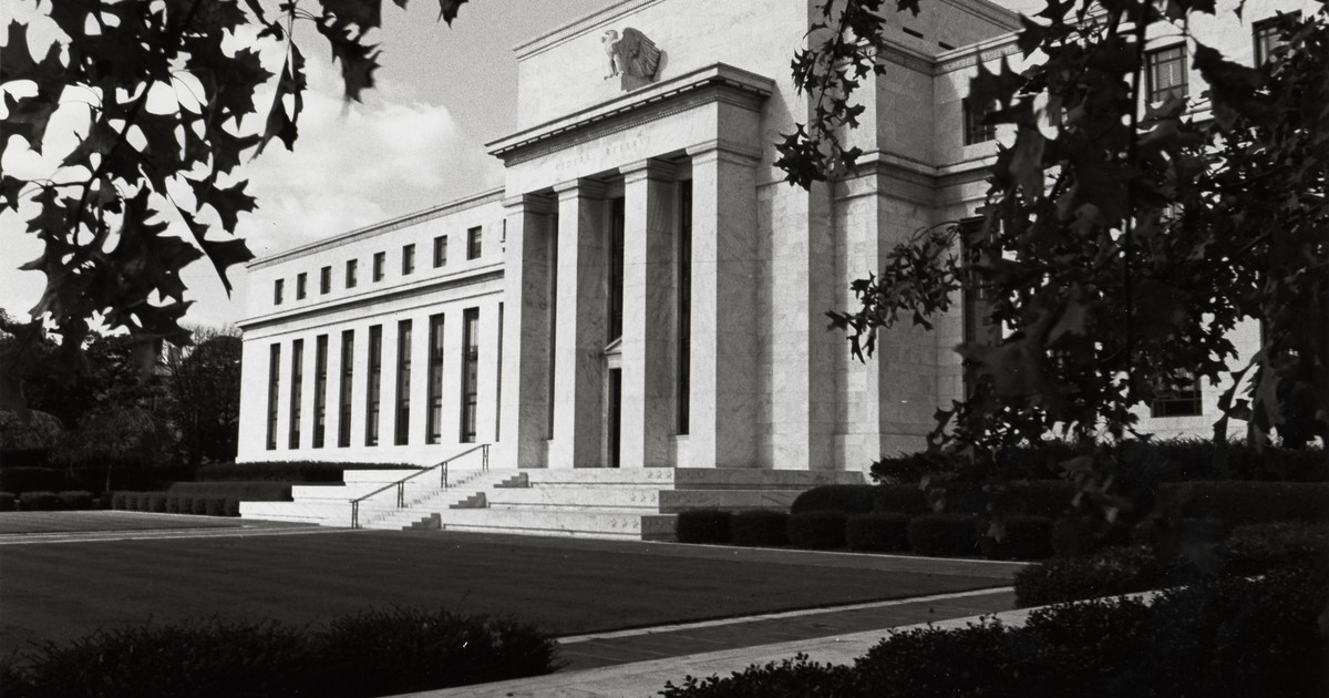Historic black-and-white exterior view of the Federal Reserve Eccles Building in Washington, DC.