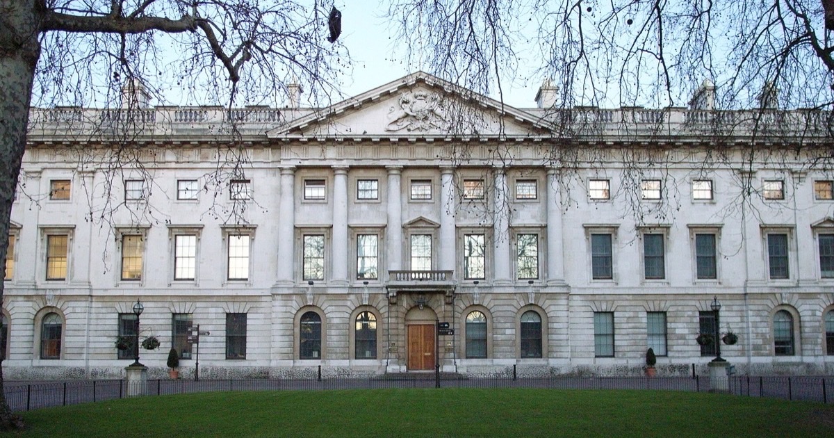 Historic brick and stone buildings at the former Royal Mint complex in London.