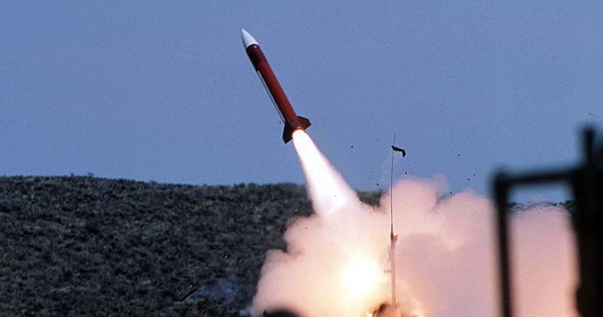 A Patriot air-defence missile launching from a ground-based battery.