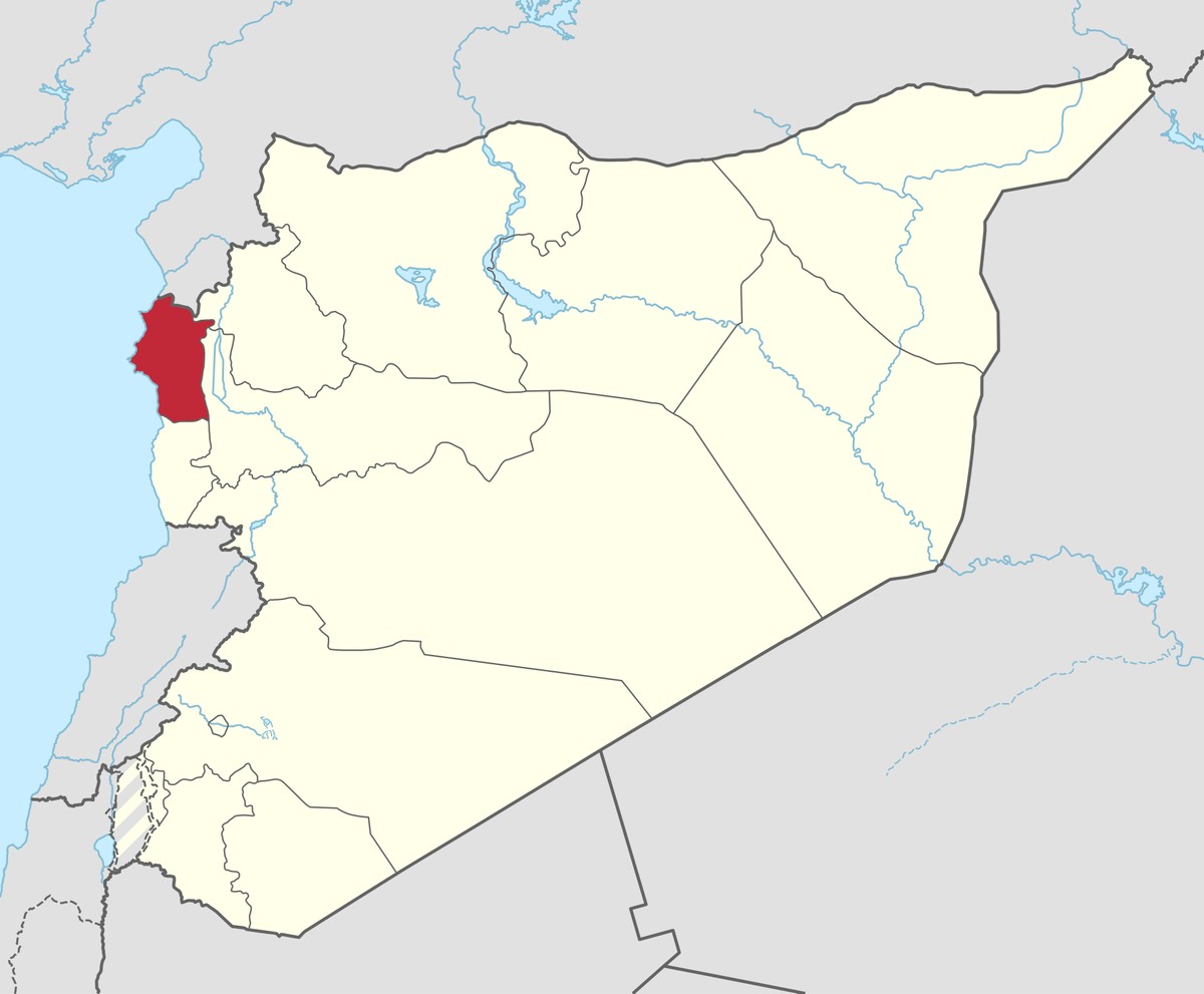 A map of Syria highlights Latakia Governorate in red on the country’s northwest Mediterranean coast.