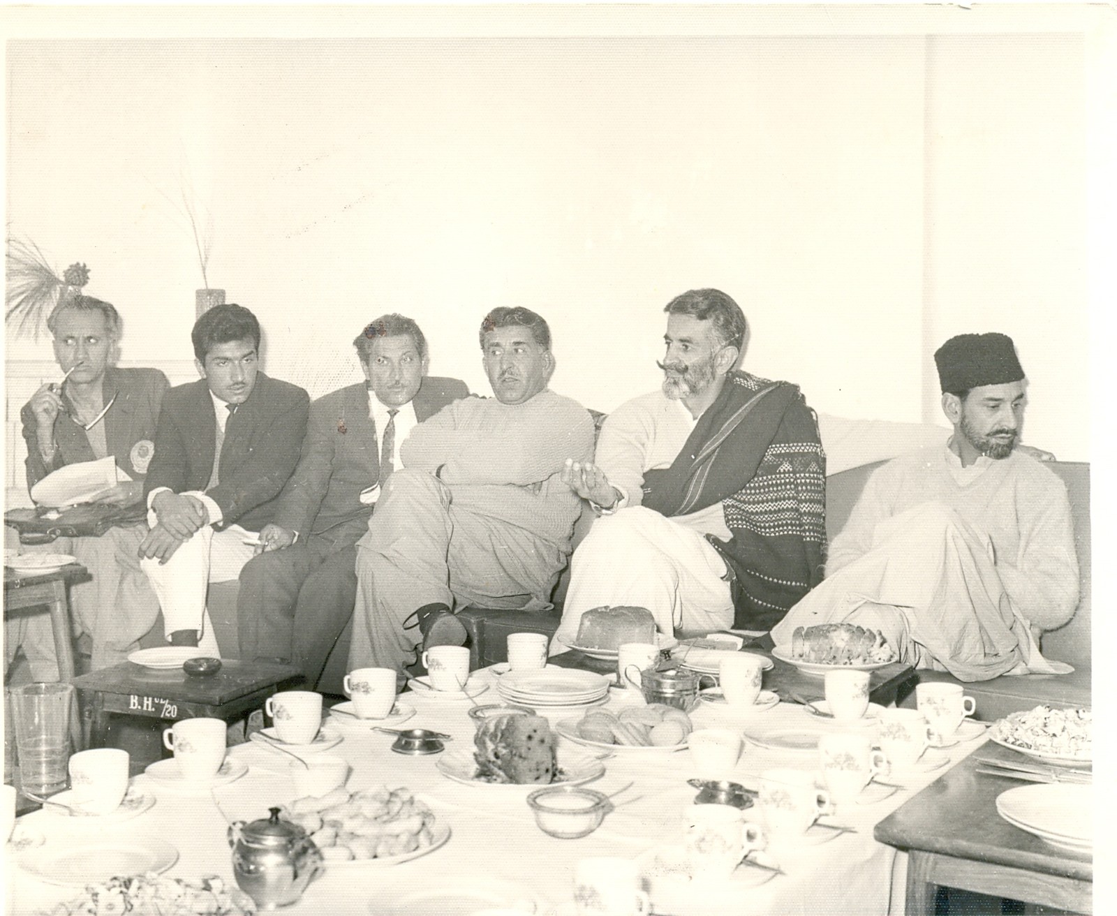 Historic group photograph of Baloch political leaders seated together, with Nawab Akbar Bugti second from right.