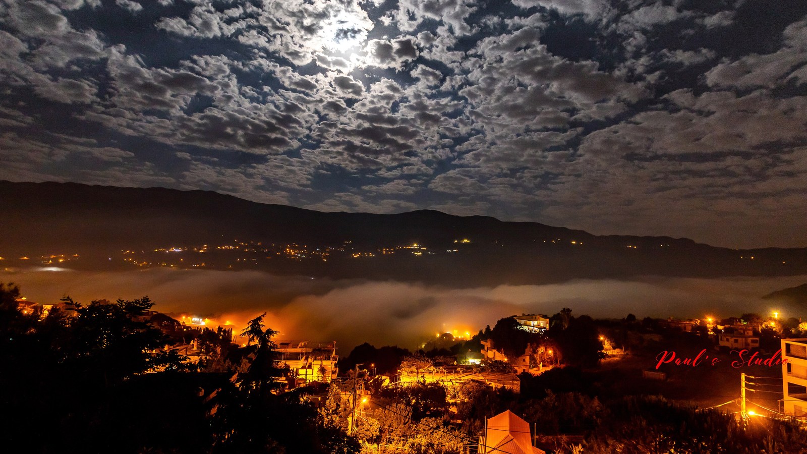 A Lebanese village landscape under a cloudy sky