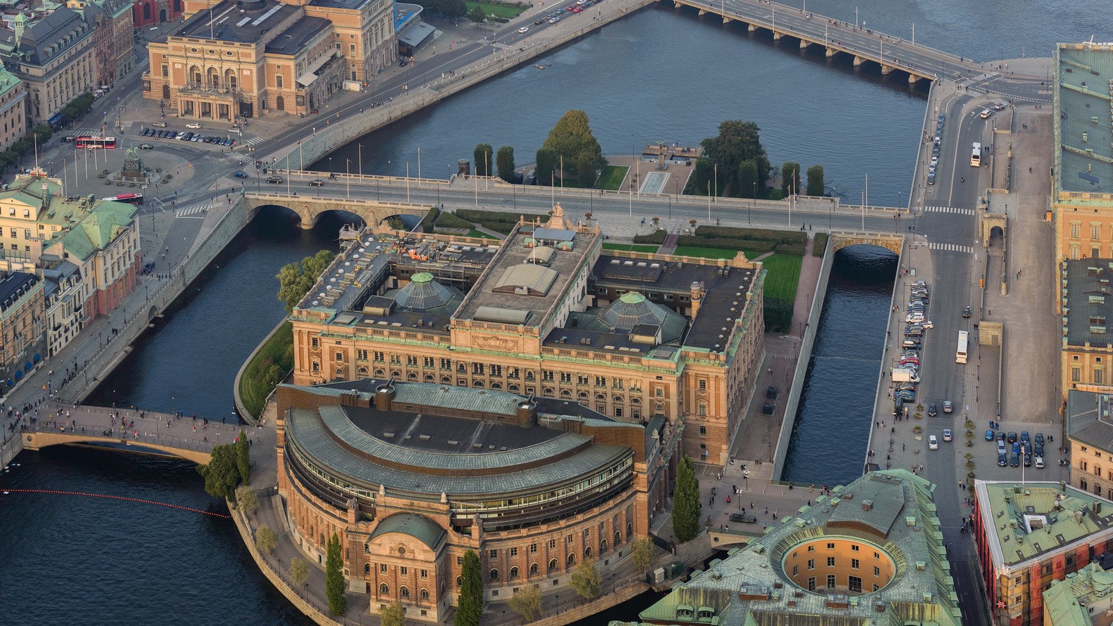 The Riksdag parliament building in Stockholm, Sweden, beside the water.