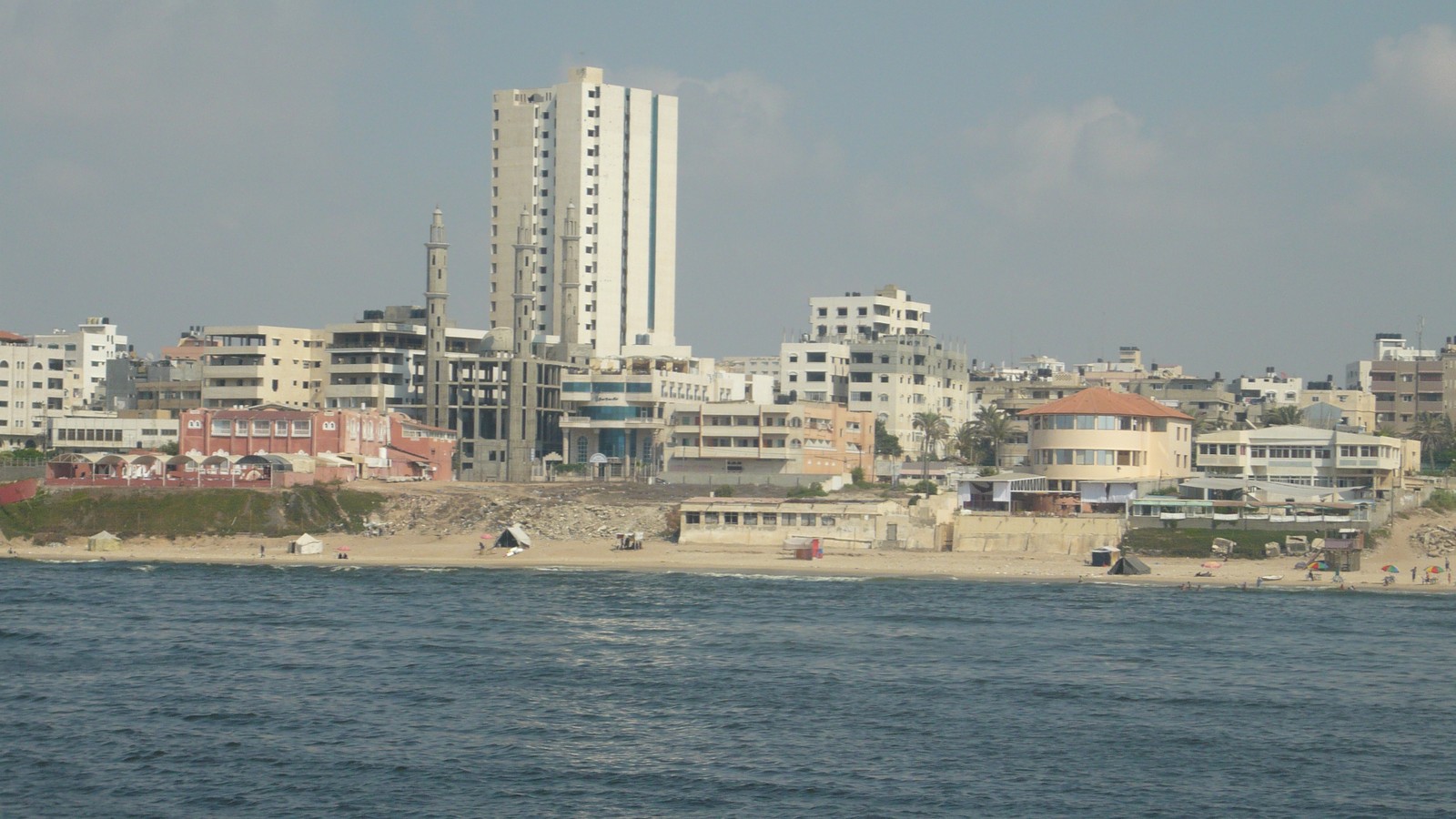 Dense urban buildings in Gaza City viewed from a distance.
